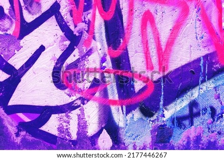 Closeup of colorful pink, purple, blue urban wall texture. Modern pattern for wallpaper design. Creative modern urban city background for advertising mockups. Grunge messy street style background Royalty-Free Stock Photo #2177446267