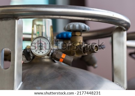 Valves of nitrogen, Helium, Oxygen tank and Gas Pressure Meter with Regulator. Gas tank. Royalty-Free Stock Photo #2177448231