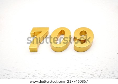     Number 709 is made of gold painted teak, 1 cm thick, laid on a white painted aerated brick floor, visualized in 3D.                                 