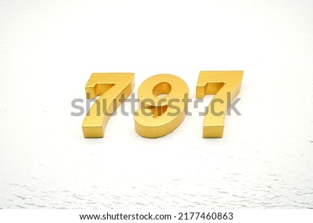  Number 797 is made of gold painted teak, 1 cm thick, laid on a white painted aerated brick floor, visualized in 3D.                                               