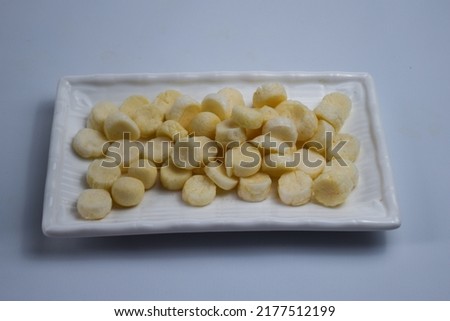 fish crackers on a plate in a rectangular shape on a white background