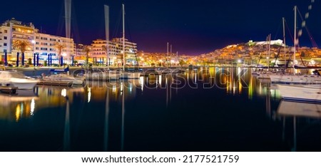 Stunning view of Kavala city, the principal seaport of eastern Macedonia and the capital of Kavala regional unit, Greece, Europe. Night summer seascape of Aegean Sea. Traveling concept background.
