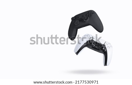 Black and white game controllers on white background Royalty-Free Stock Photo #2177530971