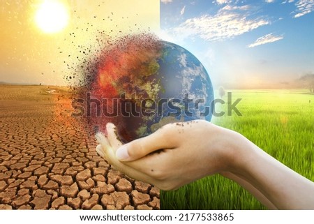 Hand of young man hold world globe with burn hot by drought environment and beautiful green abundance nature metaphor Climate change. Elements of this image furnished by NASA Royalty-Free Stock Photo #2177533865