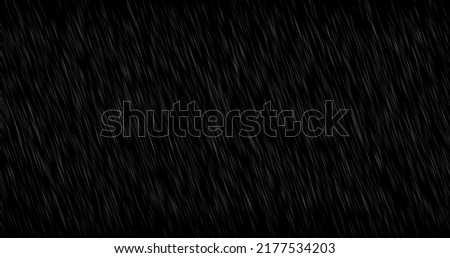 Water drops fly and fall, motion graphics of rain on a black background, particle precipitation, blending mode, water splashes, puddles. Royalty-Free Stock Photo #2177534203