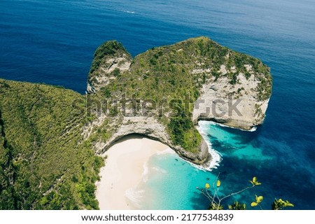 Nusa Penida Island view from the top in the sunny day, Bali, Indonesia. Kelingking beach (Manta bay) is one of the most famous and beautiful spot in Nusa Penida island. 
