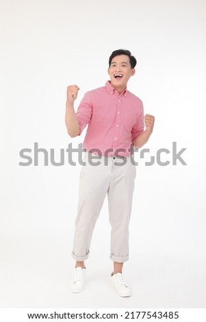 Full length body portrait of a young Asian handsome man in red shirt, isolated on white background. Concept of confidence male student, walking.