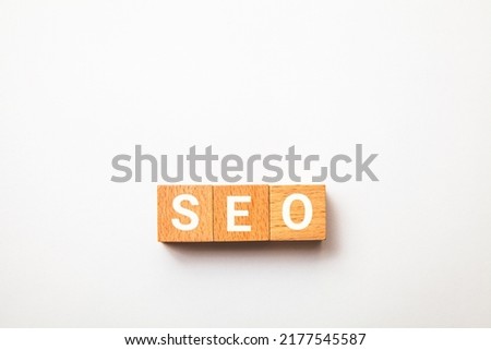 SEO. Search Engine Optimization. Search engine optimization. SEO letters drawn on a wooden block. White background.