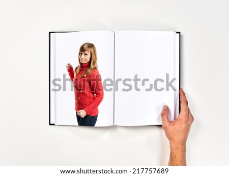 Young girl giving punch printed on book