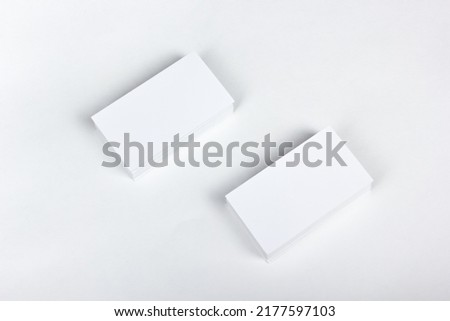 Mockup of business cards fan stack at white textured paper background