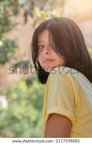Close-up outdoor portrait of a cute young girl. Beautiful teen girl posing for the camera.