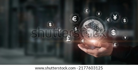 Concept of international currency market. Businessman hand shows globe and currency. Royalty-Free Stock Photo #2177603125