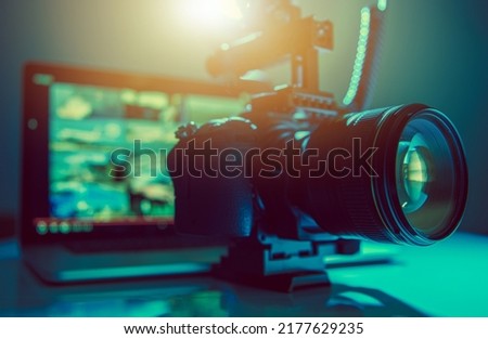 Digital Video Maker Equipment. Modern DSLR Camera and a Laptop Workstation. Royalty-Free Stock Photo #2177629235