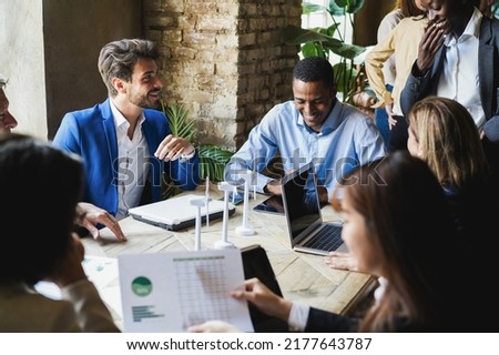Multiracial business people working on sustainable innovation project - Green renewable energy concept - Focus on left man face Royalty-Free Stock Photo #2177643787