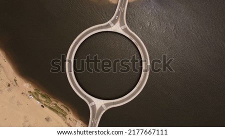 Aerial view of circular Laguna Garzón Bridge, Uruguay Royalty-Free Stock Photo #2177667111