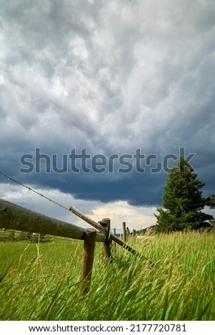 Ranchland Storm Clouds vertical. A threatening sky in rural ranch country of the Nicola Valley, British Columbia.

                                Royalty-Free Stock Photo #2177720781