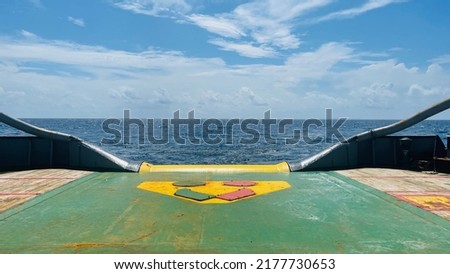 open maindeck and stern roller ship anchor handling tug and supply (AHTS) with cover shark jaw and towing pin againt clear sky background