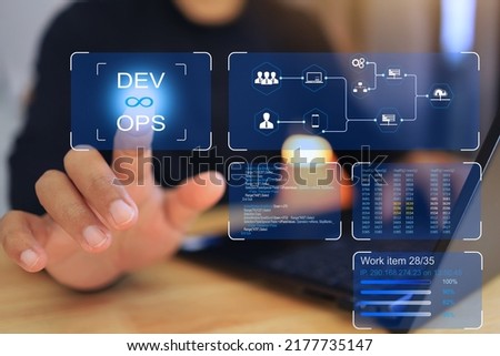 man hand reaches out to click the DEV and OPS or development and operation virtual screen. automation and technology concept. Royalty-Free Stock Photo #2177735147