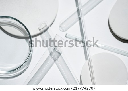 Test tubes, petri dish and glass rods in the laboratory on white background. Science research. Laboratory glassware close up. Transparent container. Medicine and beauty concept. Royalty-Free Stock Photo #2177742907