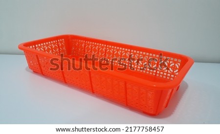 small plastic basket as a container to put things