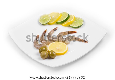 Raw tiger shrimps on plate. Isolated on a white background. 