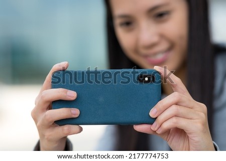 Woman use mobile phone to take photo