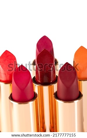 Different colors of lipstick on a white background. Decorative cosmetics.