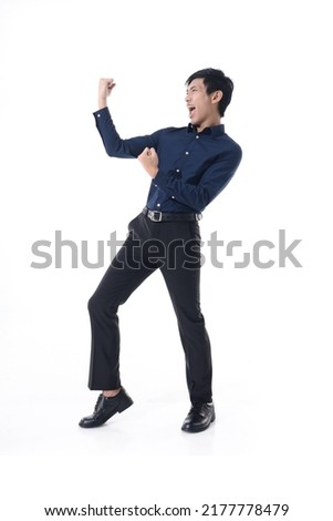 Full body portrait of young man in blue shirt with winnger gesture   standing posing white background