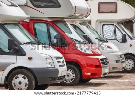 Recreational vehicle in a parking lot. Camper van. Tourism Royalty-Free Stock Photo #2177779415
