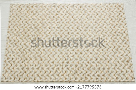 Hand woven zig zag pattern jute area rug. Royalty-Free Stock Photo #2177795573
