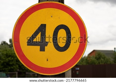 Road sign with number 40. Limiting modestness of movement. Details of transport designation. Round sign.