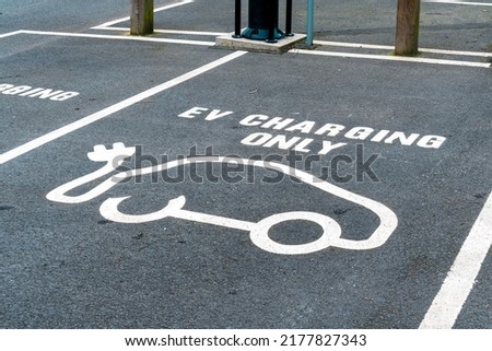 Car charging symbol painted on a parking space	
