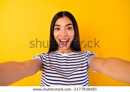 Portrait of astonished funky person take selfie open mouth isolated on yellow color background