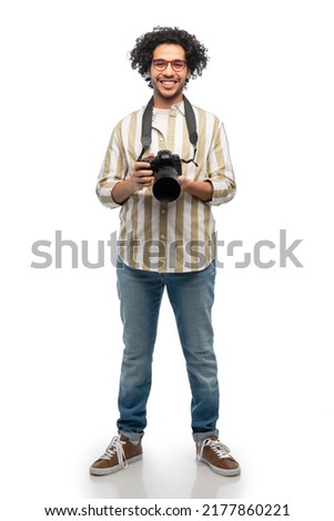 photography, profession and people and concept - happy smiling man or photographer in glasses with digital camera over white background