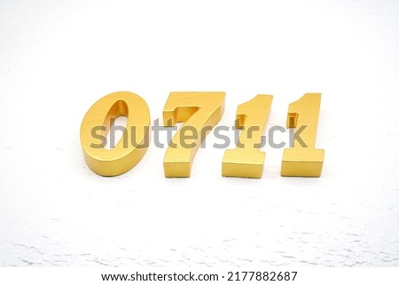    Number 0711 is made of gold painted teak, 1 cm thick, laid on a white painted aerated brick floor, visualized in 3D.                               