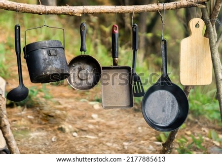 Outdoor kitchen equipment, cooking in the forest,camping Royalty-Free Stock Photo #2177885613
