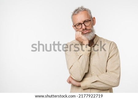 Tired sad ill bored caucasian mature middle-aged man wants to sleep, feeling negative emotions, toothache depression emotional burnout isolated in white background Royalty-Free Stock Photo #2177922719