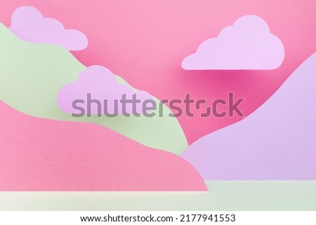 Abstract pastel colorful stage mockup - paper landscape with clouds, mountains lilac, pink, white color in cute fashion style. Template for advertising, design, presentation cosmetic produce, card. 