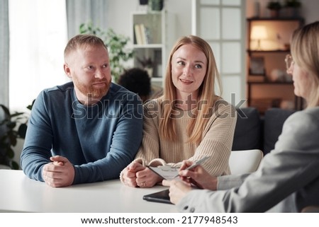 Young couple having a wish to adopt a child Royalty-Free Stock Photo #2177948543