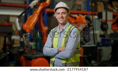 Engineer portrait, Portrait Manager engineer working with Robotic arms in factory. Engineer programming robotic operate production line manufacturing. Royalty-Free Stock Photo #2177954187