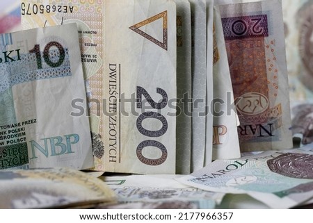 Polish money. Polish zloty banknotes placed next to each other and are the backdrop to many various financial matters. PLN currency.