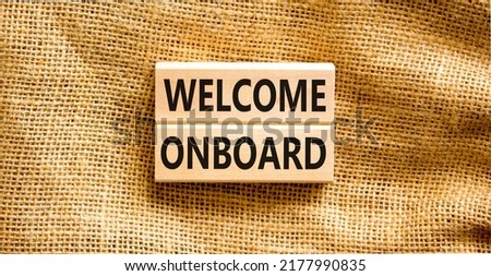 Welcome onboard symbol. Concept words Welcome onboard on wooden blocks on a beautiful canvas table canvas background. Business onboarding and welcome onboard concept, copy space.