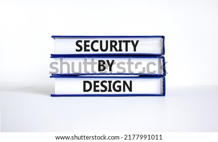 Security by design symbol. Concept words Security by design on books on a beautiful white table white background. Business finacial security by design concept. Copy space.
