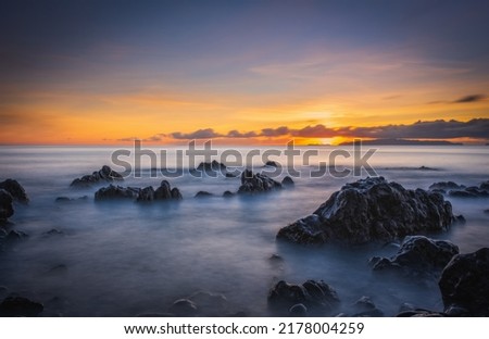 Sunrise on Reis Magos beach. Canico, Madeira, Portugal.  Long exposure picture