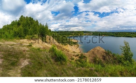 On the shore of the Pugarevsky quarry . Summer landscape. Leningrad region. Vsevolozhsk Royalty-Free Stock Photo #2178012859