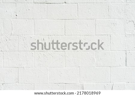 White painted brick wall surface close-up. Urban background