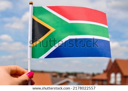 close up of national flag of south africa,red green and blue colors.