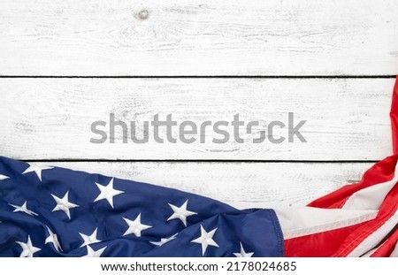 Flat lay USA flag on white wooden board, vintage background with copy space top view. Banner, minimalism. American