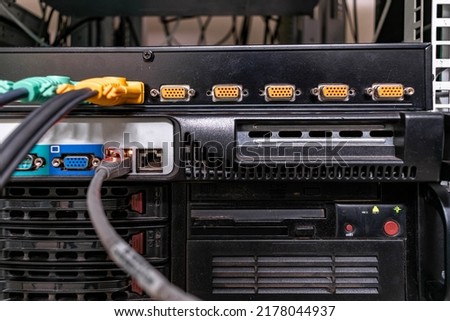Remote access equipment works in the data center. There is a kvm switch in the server room. The front panel of the kvm switch is a close-up. Royalty-Free Stock Photo #2178044937