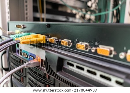 There is a kvm switch in the server room. Remote access equipment works in the data center. The front panel of the kvm switch is a close-up. selective focus Royalty-Free Stock Photo #2178044939